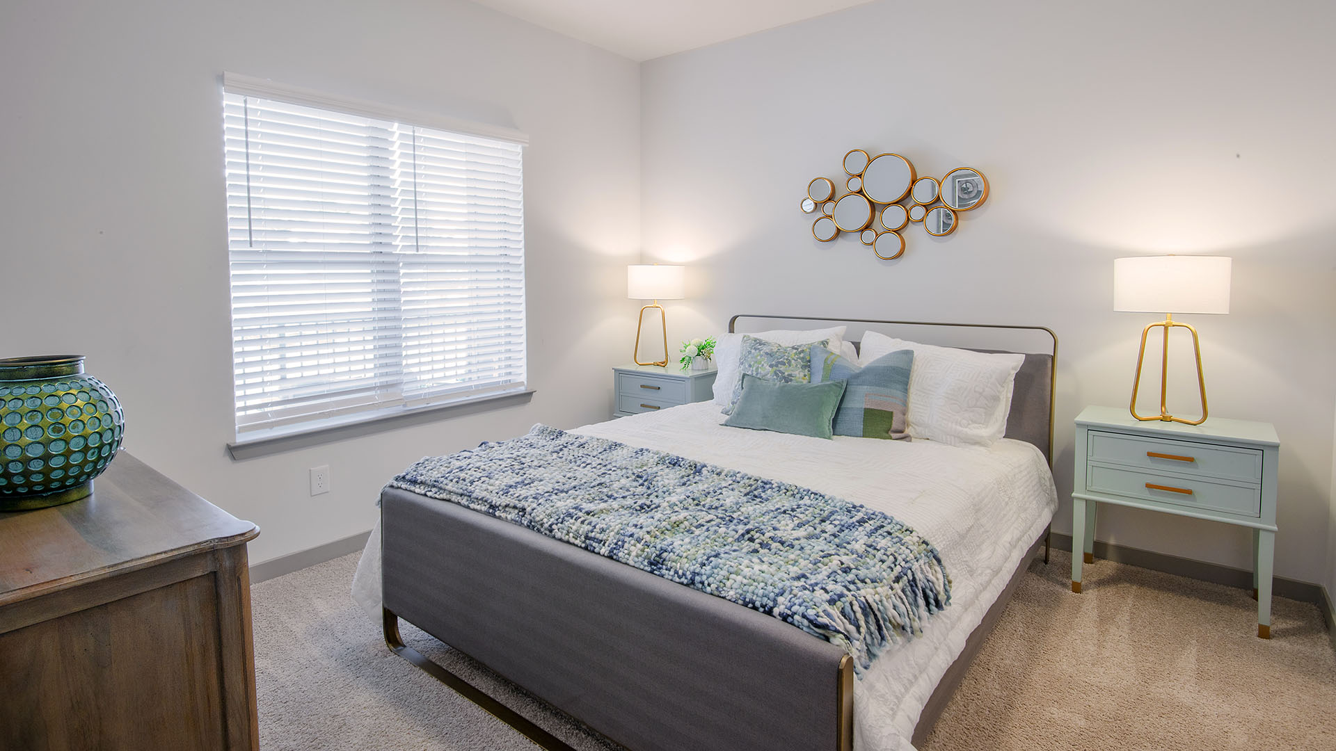 Two-Bedroom Apartments in Birmingham, AL- Axel Row- Wall-to-Wall Carpet with Large Window and Matching Blue Night Stands